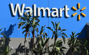 (FILES) In this file photo taken on August 15, 2022, a Walmart store in Burbank, California. - Walmart saw its earnings top expectations in the third quarter on November 15, 2022, as consumers looked for bargains amid surging inflation, but its numbers were bogged down after a settlement announced November 2, relating to opioid cases. The big-box retailer said it "continued to gain market share" in the grocery segment, raising its full-year outlook on strong results despite a challenging environment this year. (Photo by Robyn Beck / AFP)