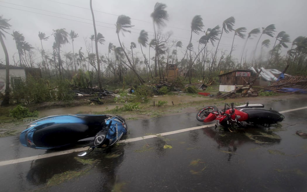 Motorcycles lie on a street in Puri district after Cyclone Fani hit the coastal eastern state of Odisha, India, Friday, May 3, 2019.