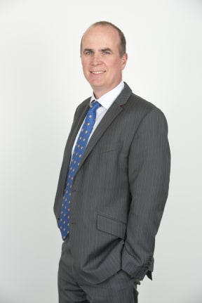 A portrait of immigration lawyer Alastair McClymont.