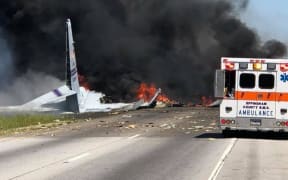 A US military cargo place is engulfed in flames and smoke down after it crashed in Savannah, Georgia on 3 May, 2018.