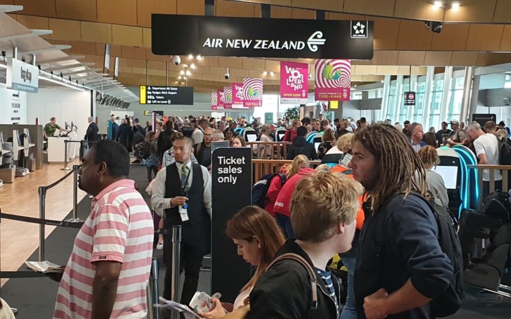 Long queues at Air New Zealand check-in counters at Wellington Airport on Tuesday morning.