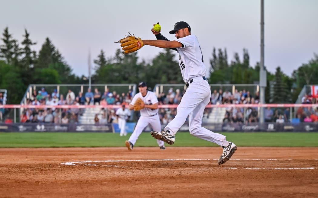 New Zealand Black Sox pitcher, Pita Rona, son of Brad Rona - a four-time Black Sox world champion - pitched the side to its first victory at the WBSC Softball World Cup Finals against Canada.