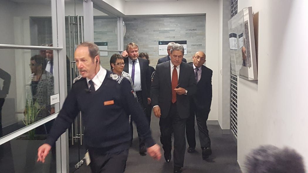 Winston Peters (second right) emerging from his meeting with National.