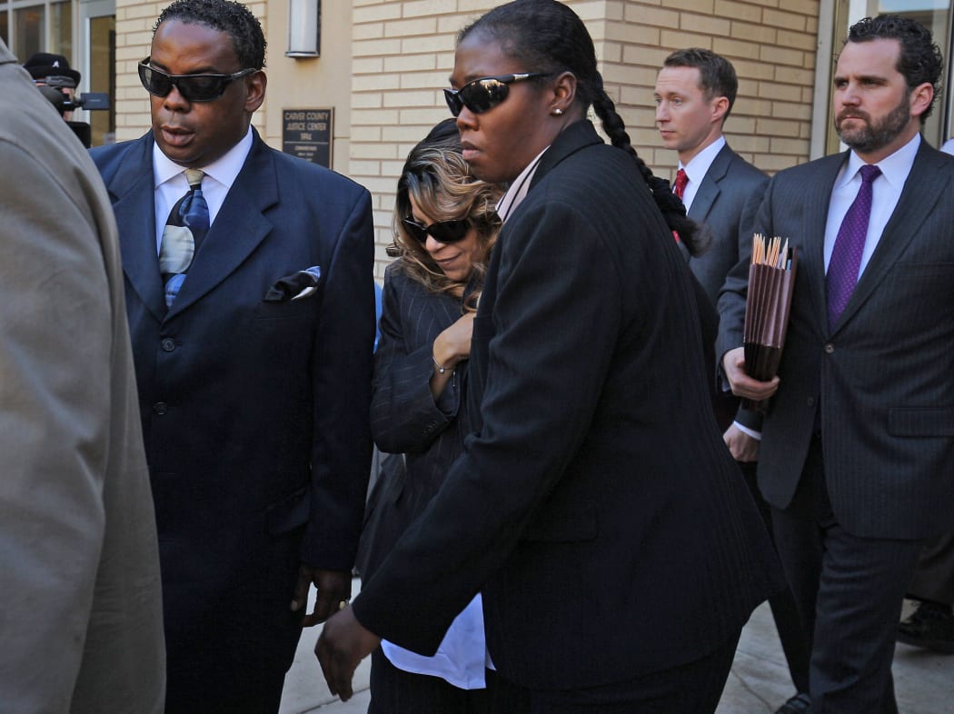 Tyka Nelson and her attorneys leaving the courthouse.