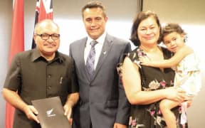 PNG PM Peter O'Neill, (left), and NZ High Commissioner Phillip Taula and his family.