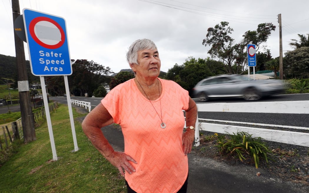Taurikura's Jan Boyes at the Whangārei Heads coastal settlement ahead of the reveal of what was formerly a 50km/h speed area's new 30km/h slower speed sign as part of changes she says are OTT and micro-managing traffic speeds.