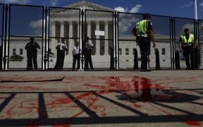 Red paint thrown by an abortion-rights activist is seen in front of the Supreme Court building.