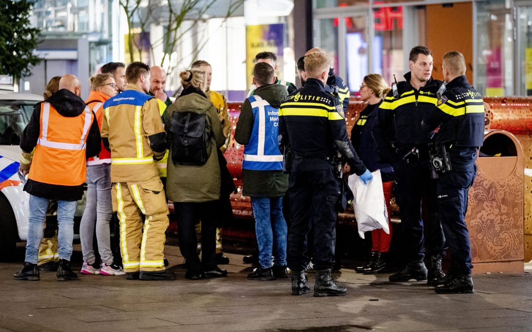 Police at the Grote Marktstraat, a main shopping street in The Hague, after several people were wounded in a stabbing incident on November 29, 2019. Police said they were looking for a "slightly dark-skinned man" aged between 40 and 50 wearing a black top, scarf and grey jogging bottoms.