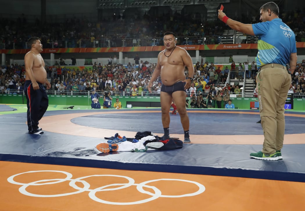 Mongolian wrestling coaches strip ff in protest of 65kg bronze medal match outcome
