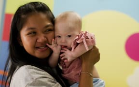 Thai surrogate mother Pattaramon Chanbua holds her baby Gammy, born with Down Syndrome.