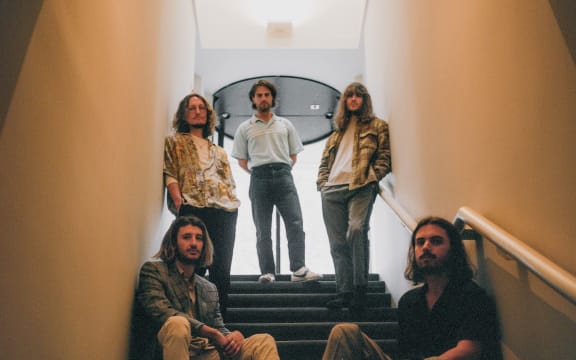 Daily J posing on a stair case