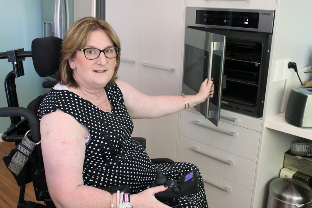 A photo of Helen Grice in her modified kitchen.