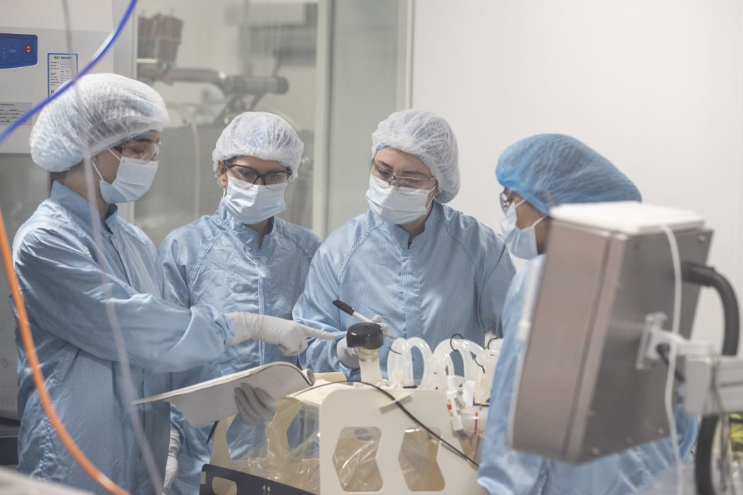 Technicians work at Oxford BioMedica where the Oxford/Astrazeneca Covid-19 vaccine is being manufactured in Oxford on January 18, 2021. (Photo by Heathcliff O'Malley / POOL / AFP)