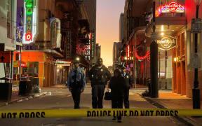 Police cordon off the area around the site of the overnight attack in the French Quarter of New Orleans, Louisiana, on January 1, 2025. - At least 10 people were killed and 30 injured Wednesday when a vehicle plowed overnight into a New year's crowd in the heart of the thriving New Orleans tourist district, authorities in the southern US city said. (Photo by Matthew HINTON / AFP)