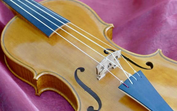 Anne Loeser's baroque violin with strings crossed over