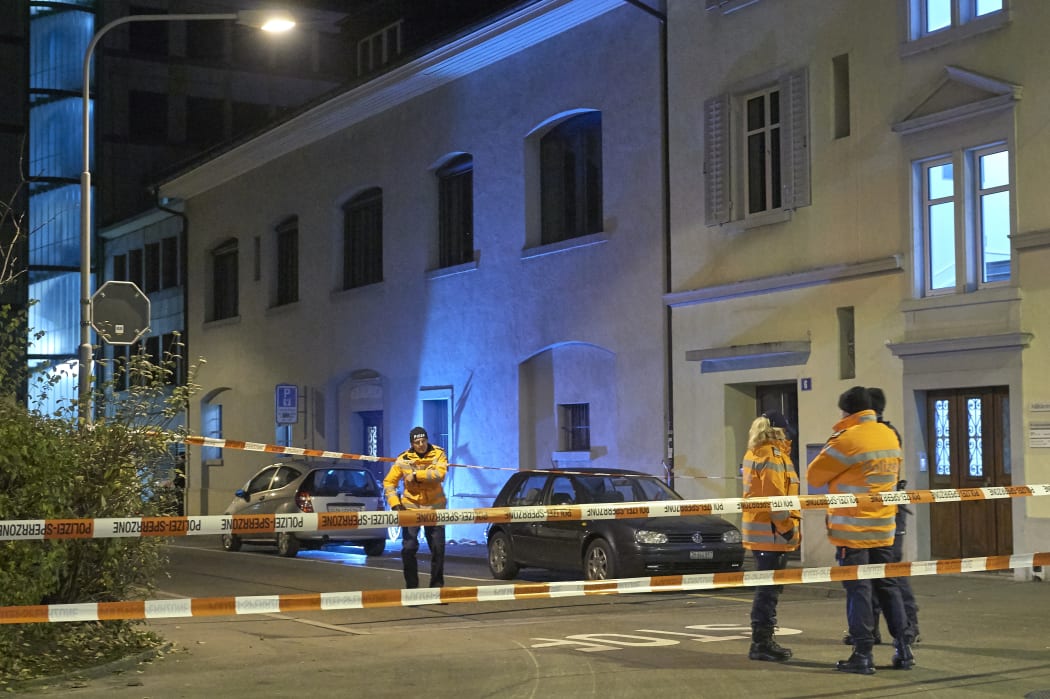 Police outside the prayer hall in central Zurich where three people were injured in a shooting.
