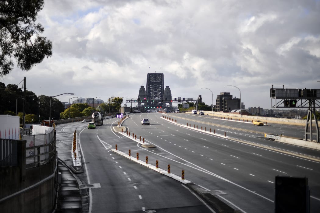 Motorists commute on the Harbour Bridge in Sydney on 28 June 2021, during a two-week coronavirus lockdown to contain an outbreak of the highly contagious Delta variant.