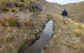 Water channel on dry hillside