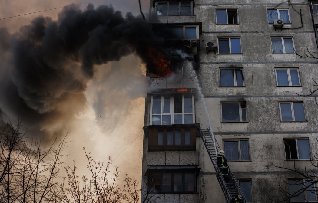 KYIV, UKRAINE - MARCH 15: Firefighters respond a fire erupted after an apartment building hit by Russian attacks in Kyiv, Ukraine on March 15, 2022. Fire erupts after 16-story apartment building shelled in Sviatoshynskyi district in Kyiv.