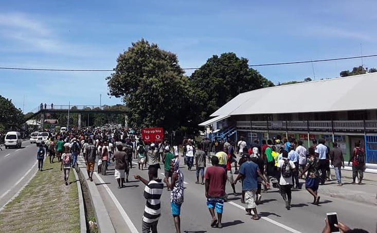 One of the angry mobs in Solomon Islands walking down the main road past Chinatown in Honiara after the election of the prime minister. 24 April 2019