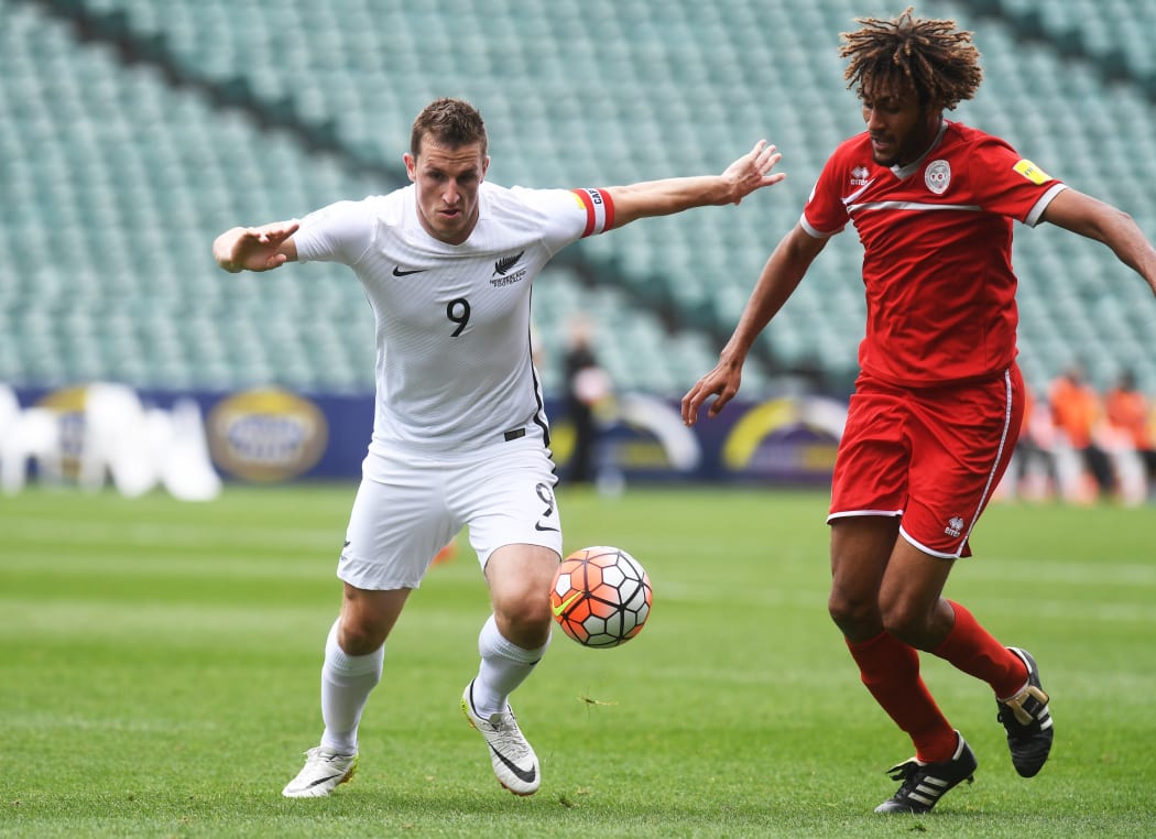 All Whites captain Chris Wood and New Caledonia's Cedric Sansot clash in Kone on 15 November 2016.