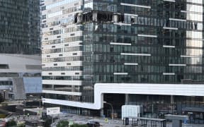A view of a damaged office block of the Moscow International Business Center (Moskva City) following a reported drone attack in Moscow on July 30, 2023. Three Ukrainian drones were downed over Moscow early on July 30, 2023, Russia's defence ministry said, in an attack that briefly shut an international airport. While one of the drones was shot down on the city's outskirts, two others were "suppressed by electronic warfare" and smashed into an office complex. No one was injured. (Photo by Alexander NEMENOV / AFP)