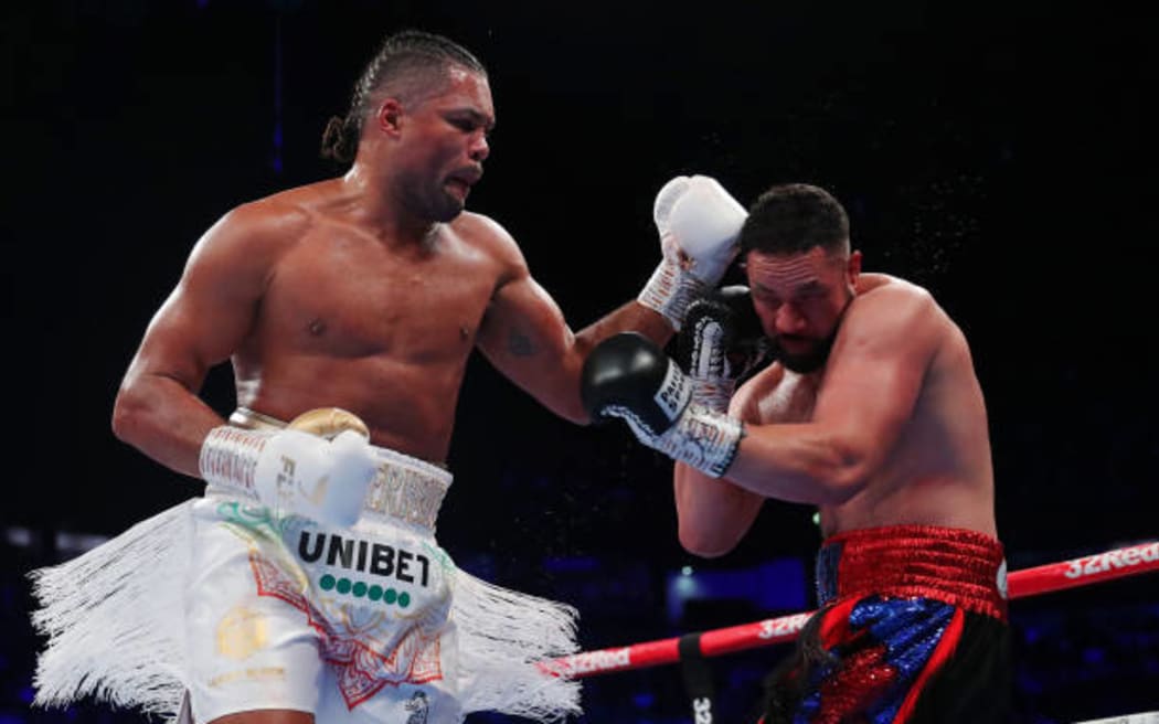 Joe Joyce punches Joseph Parker during the Vacant WBO Interim World Heavyweight Championship fight in 2022.