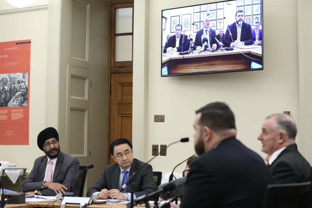 National MPs Jian Yang and Kanwaljit Singh Bakshi listen to Trevor Mallard in estimates hearings 2019