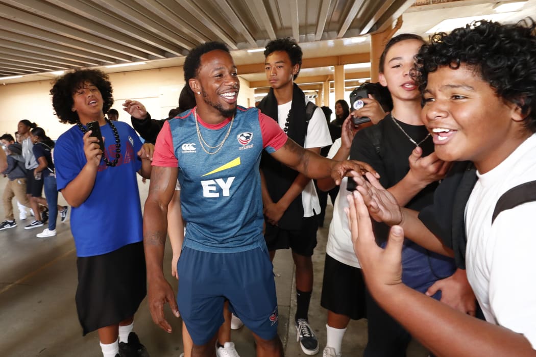 Samoa will have to combat USA sevens star Carlin Isles, seen here during a school visit in Los Angeles, in their opening pool game.