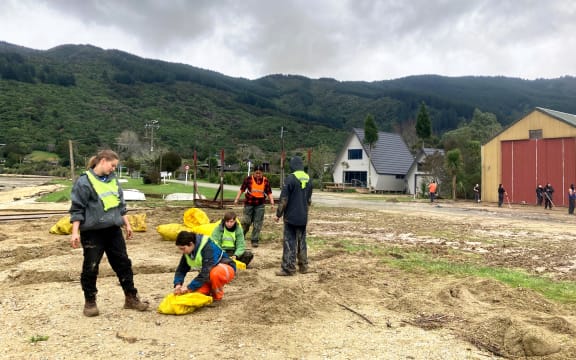 Students making sandbags in Anakiwa.