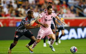 Lionel Messi (R) in action for Miami.