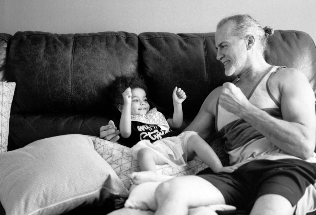 father and child playing