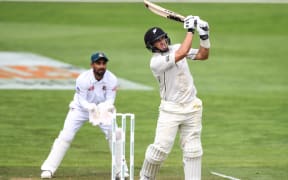 Ross Taylor hits a six to bring up his century, on his way to 200 in the first test between the New Zealand Black Caps and Bangladesh.
