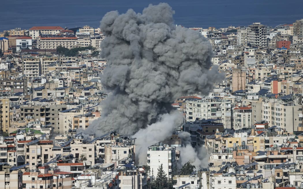 A plume of smoke rises from the site of an Israeli airstrike in the southern suburbs of Beirut's Haret Hreik neighborhood on March 4, 2026. Israel launched fresh strikes on Iran and Lebanon, where state media reported a residential building was hit on March 4, as Iran's Guards said they had sealed off one of the world's most vital shipping routes for energy. (Photo by IBRAHIM AMRO / AFP)