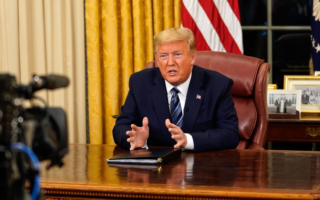 US President Donald Trump addresses the Nation from the Oval Office about the widening novel coronavirus (Covid-19) crisis in Washington, DC on March 11, 2020.