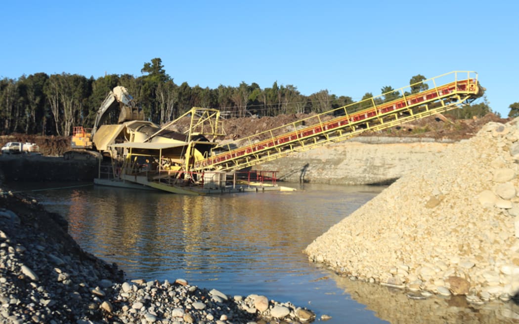 Alluvial gold mining on the West Coast .