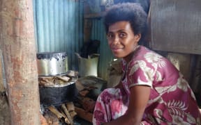A Nawaisomo woman cooking. Food is the biggest problem now according to the village chief.