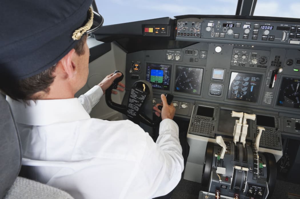 Pilot in airplane cockpit