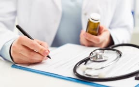Doctor prescribing pills
