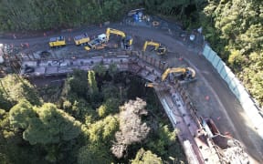 Anchors securing the wall deep into the hillside are installed at slip site A12.