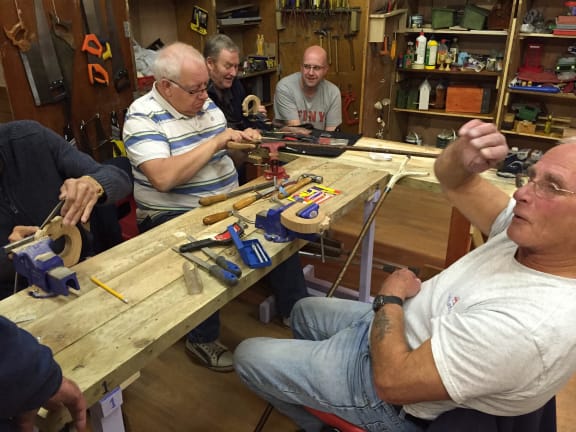 The international men's shed movement aims to bring men together to lessen their isolation and improve their mental health.