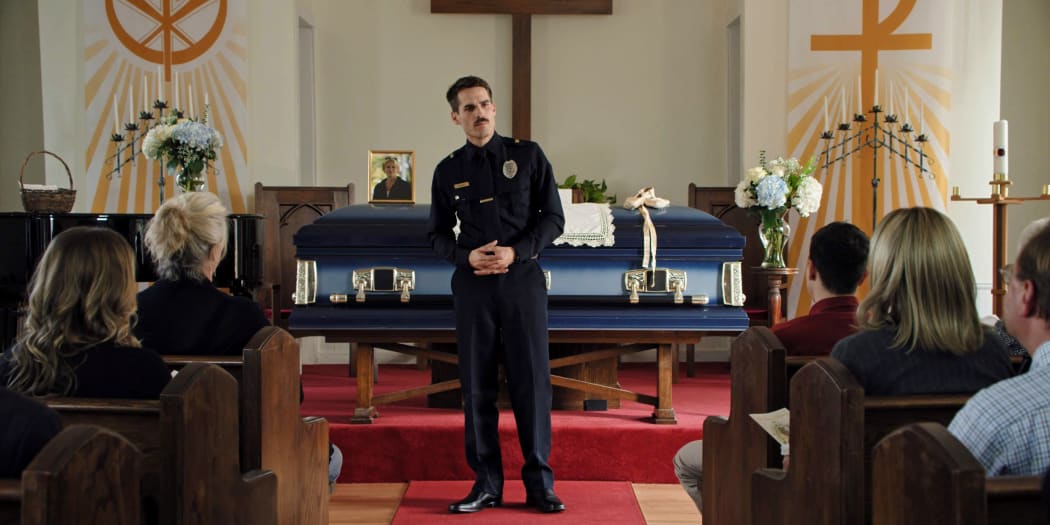 Writer, director and star, Jim Cummings as Officer Jim Arnaud in Thunder Road.