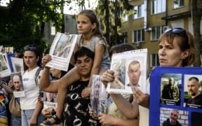 The largest prisoner POW exchange since the start of Russia's full-scale invasion takes place between Ukraine and Russia. 1,000 Ukrainian soldiers and civilians return from Russian captivity, while an equal number of individuals return to Russia. The exchange is carried out under the ''1000 for 1000'' agreement, reached during negotiations in Turkey. In North Ukraine, on May 23, 2025, the prisoner POW exchange is set to last for three days. Relatives of Ukrainian servicemen who are in Russian captivity or listed as missing in action await the outcome of the exchange. (Photo by Maxym Marusenko/NurPhoto) (Photo by Maxym Marusenko / NurPhoto / NurPhoto via AFP)