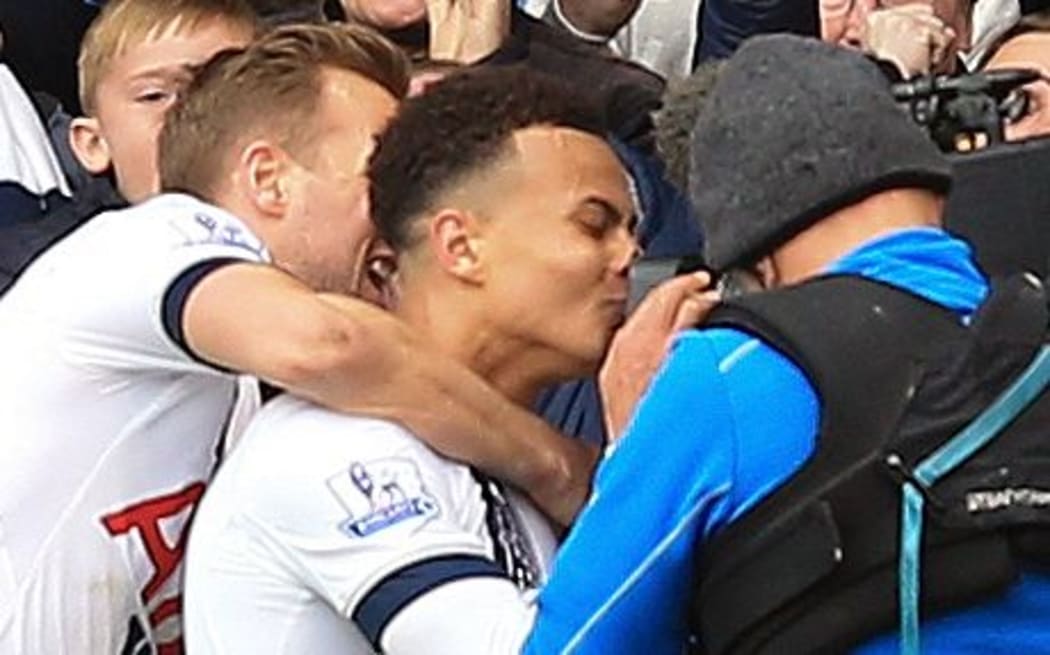 Tottenham's Dele Alli kisses the camera after scoring a goal.