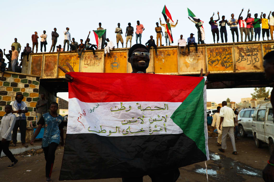 Sudanese demonstrators demand a civilian transition government in front of military headquarters this month.