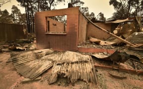 A house destroyed by a bushfire outside Batemans Bay in New South Wales on 2 January, 2020. Smoke from wide ranging fierce bushfires reached as far away as Brazil.