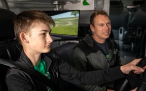 Brad Mannering teaching a learner driver in his car simulator