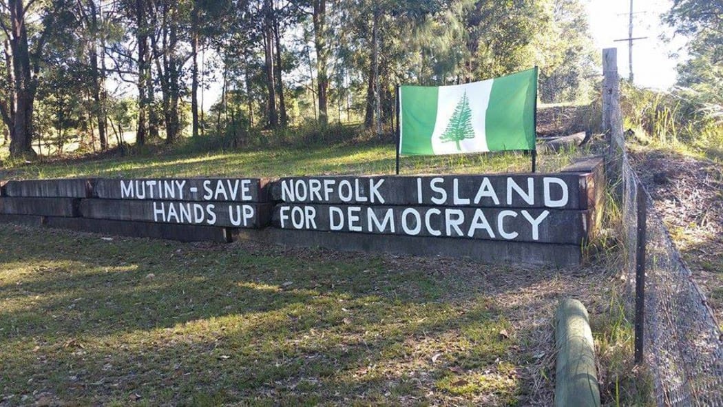 Protesters have been hanging up banners and signs around Norfolk Island
