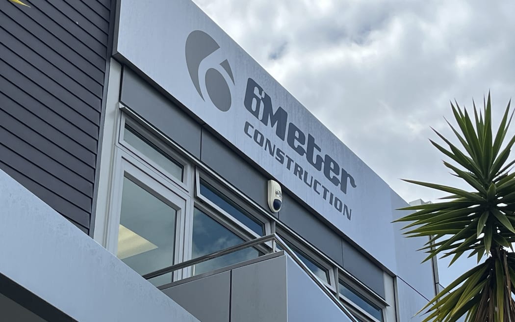 The front of an industrial building with the name 6Meter Construction on it.
