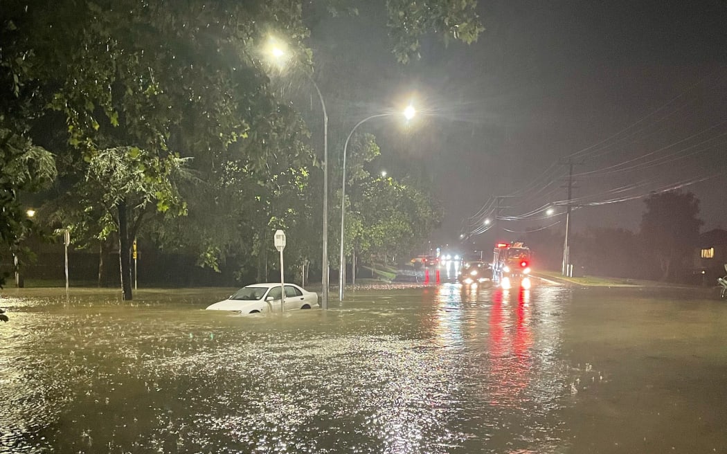 Flooding on the corner of Seabrooke and Margan Avenues in the Auckland suburb of New Lynn on 27 January 2023.